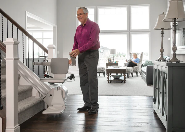 Technician installing a wheelchair lift in a home